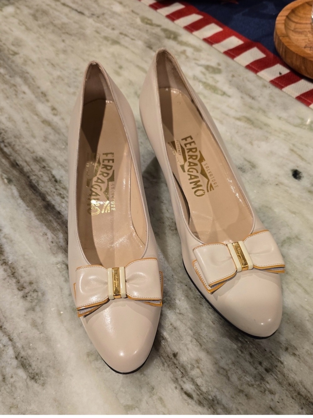 Salvatore Ferragamo Cream Bow Pumps with Gold Accent